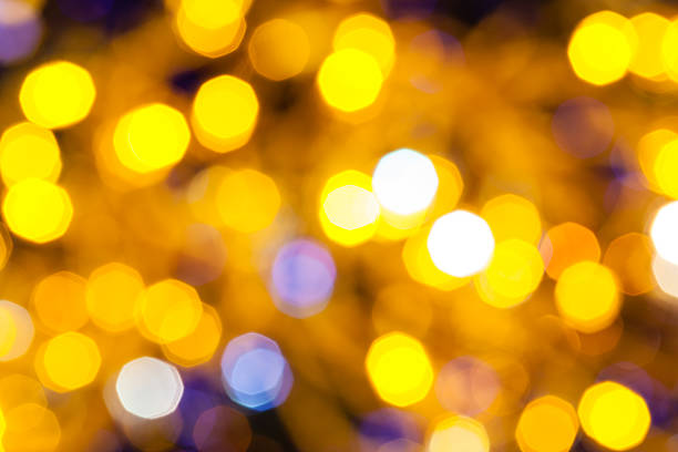 istock blue and yellow shimmering Christmas lights 483820872