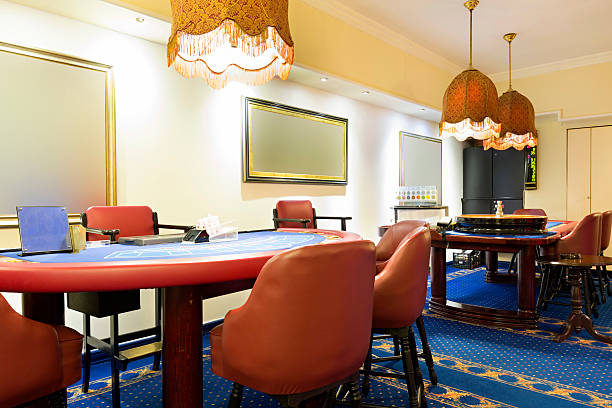 istock Blackjack and roulette tables at casino 483821208