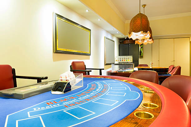 istock Blackjack and roulette tables at casino 483821226