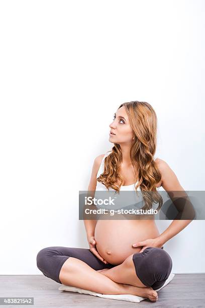 Thinking About Her Baby Stock Photo - Download Image Now - 2015, Adult, Adults Only