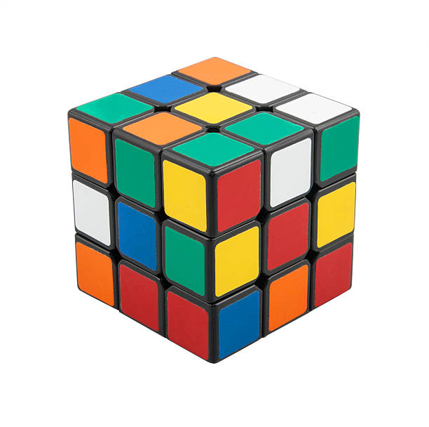 Classic Rubik's Cube Kragujevac, Serbia - January 11, 2014: Rubik's Cube on a white background. Rubik's Cube invented by a Hungarian architect Ernő Rubik in 1974. puzzle cube stock pictures, royalty-free photos & images