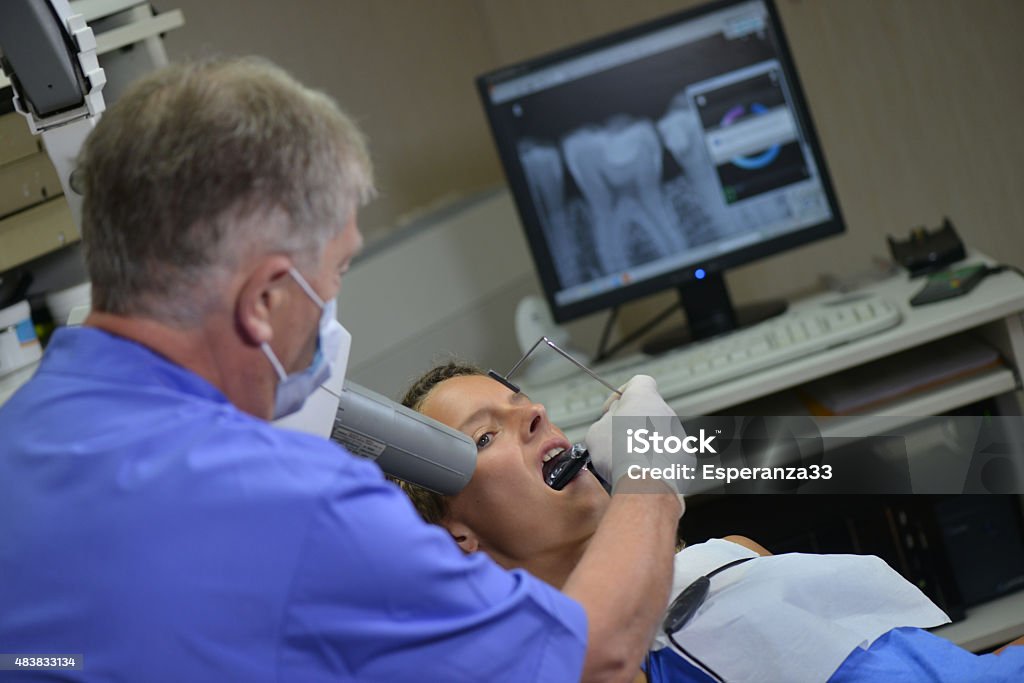 Women at Dentist Woman undergoing dental procedure 20-24 Years Stock Photo