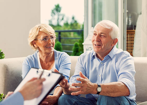 Senior couple talking with financial advisor