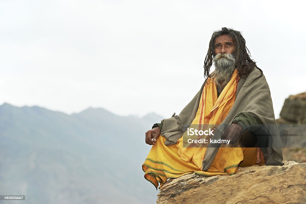 Indian monk sadhu Indian old monk sadhu in saffron color clothing Guru Stock Photo