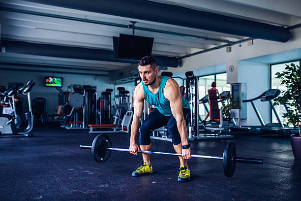 istock gym instructor at the gym doing Deadlift exercises 483837218