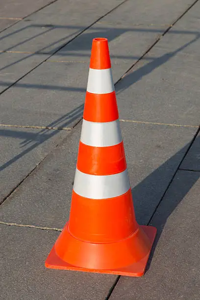 reflective traffic cone with orange and silver stripes