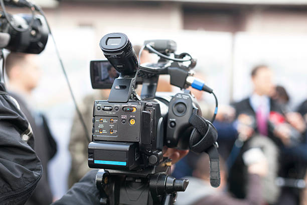 istock Covering an event with a video camera 483837591