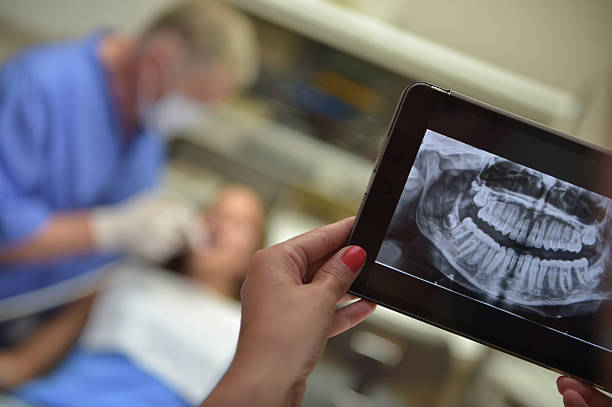 istock Dentist Office-Digital tablet with a patients x-rays 483837930