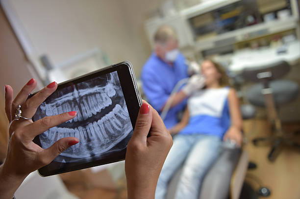 istock Dentist Office-Digital tablet with a patients x-rays 483837984