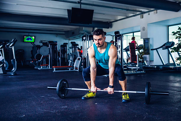 istock gym instructor at the gym doing Deadlift exercises 483837986