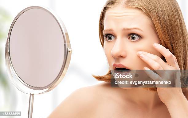 Beautiful Healthy Woman Saw In The Mirror Acne And Wrinkles Stock Photo - Download Image Now