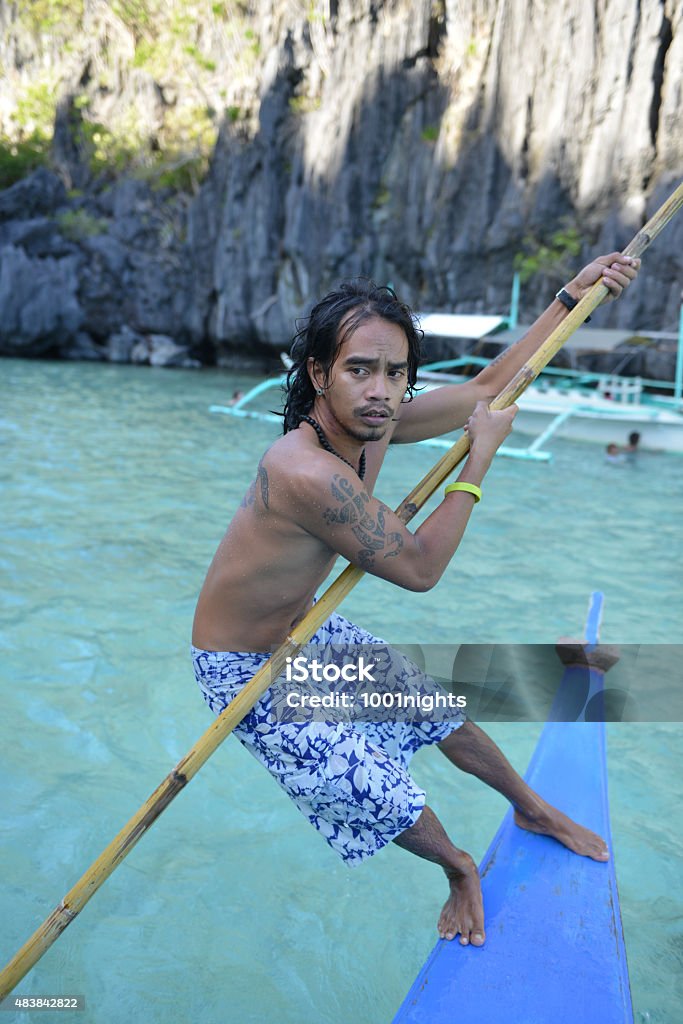 philippino on his traditional banca philippino on his traditional banca outrigger boats in the philippines 2015 Stock Photo
