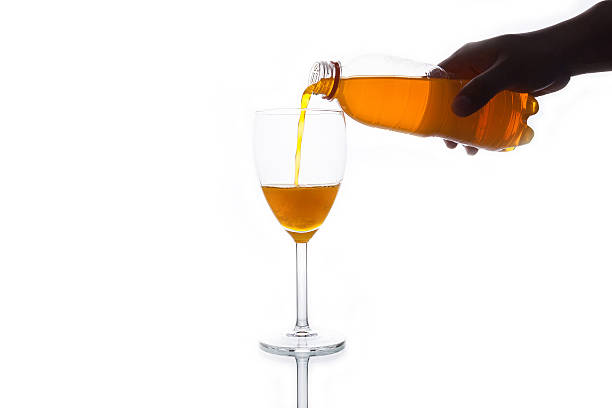 istock Orange soda pouring into glass 483845104