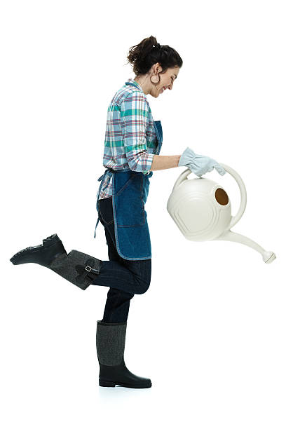 istock Woman with watering can 483848504