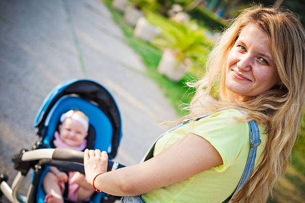 istock Woman taking baby for a walk 483851836