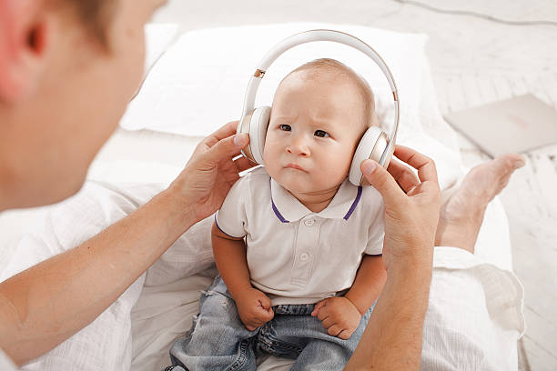 istock young father with his nine months old som on the 483852594