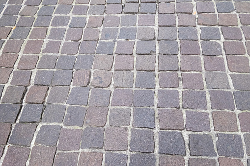 Abstract image of a paved stone pathway.