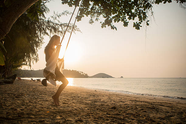 istock Young woman on swing 483855779