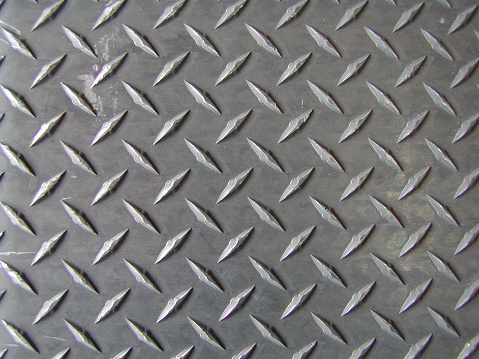 closeup of the non-slip surface of a steel ramp.