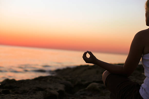 istock Lotus position on the edge of a cliff 483856418