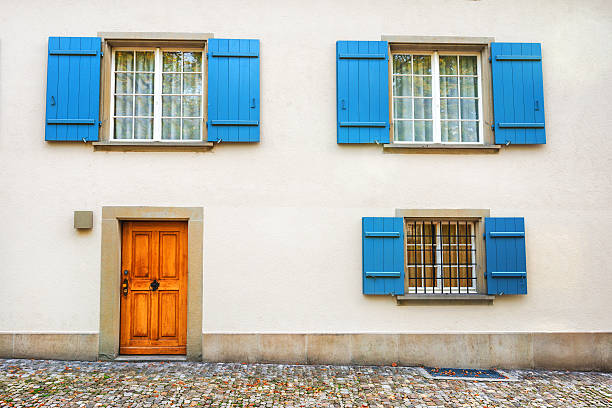 Typical Provencal House with White Wall, wooden door and Blue Windows. Really beautiful french house in classic style.