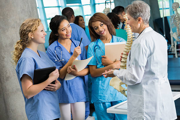 istock College professor answering questions during medical nursing class 483857229