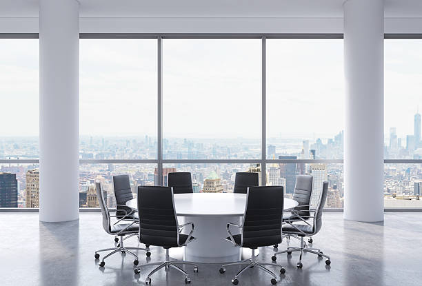 Panoramic conference room in modern office Panoramic conference room in modern office, New York city view. Black chairs and a white round table. 3D rendering. late modern period stock pictures, royalty-free photos & images