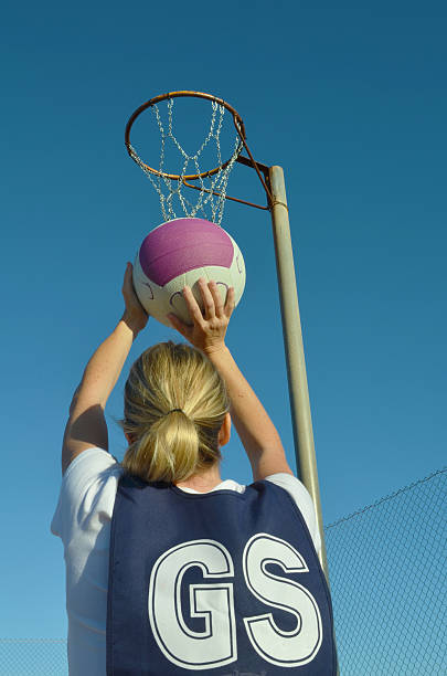 Woman Shooting a Netball
