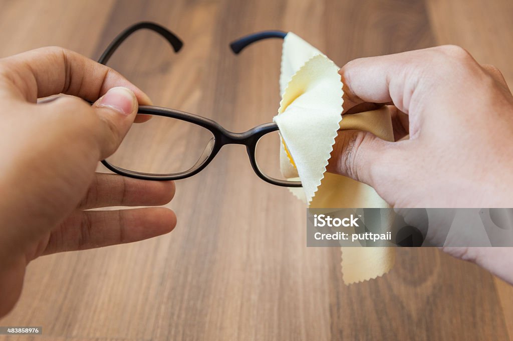 cleaning glasses both hand cleaning glasses with cloth Clean Stock Photo
