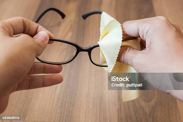 Cleaning Glasses Stock Photo - Download Image Now - Clean, Cleaning, Eyeglasses