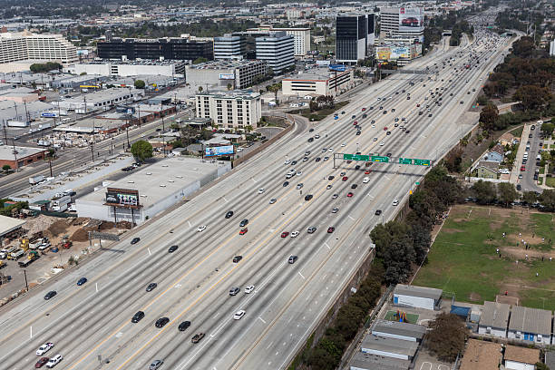 San Diego Freeway Aerial Los Angeles, California, USA - March 22, 2014: Aerial of light weekend traffic on the massive San Diego 405 freeway in west Los Angeles. san diego freeway stock pictures, royalty-free photos & images