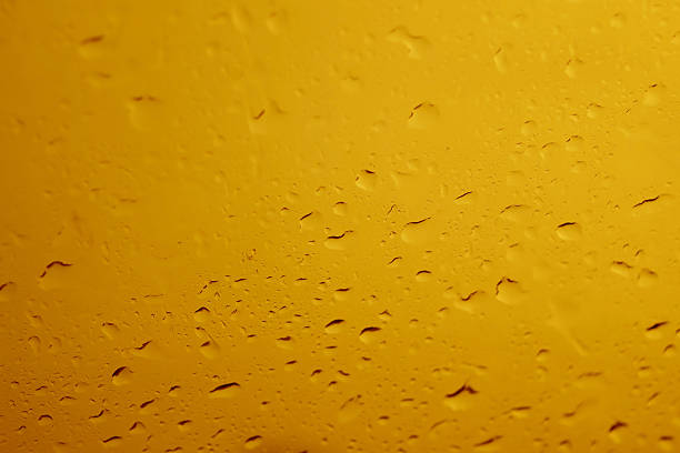 istock Yellow Beer Water drops on glass background 483860606