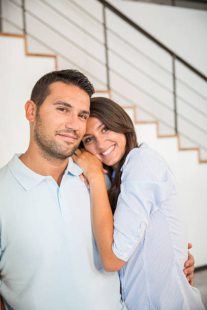 istock Smiling young couple in new home 483860620