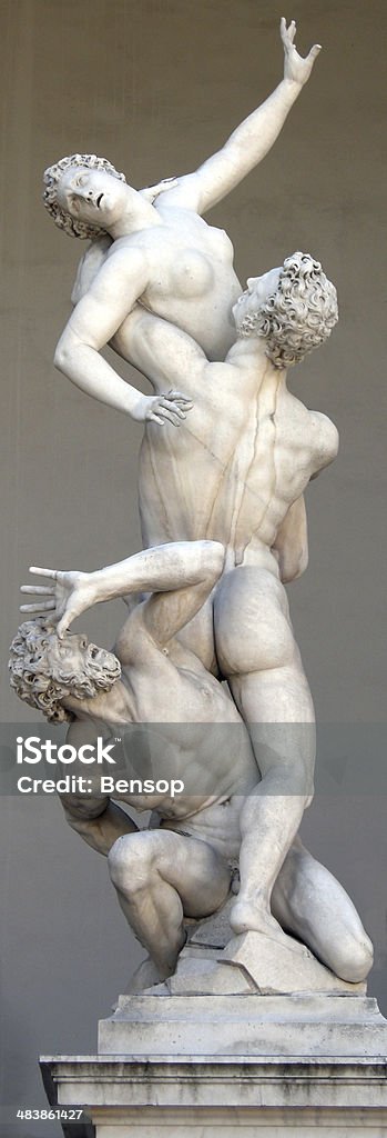 The Rape of the Sabine Women The Renaissance sculptor Giambolognas carved this sculpture, showing three intertwined figures, from a single block of Marble. It is situated in the Piazza della Signoria, Florence, Italy. Adult Stock Photo