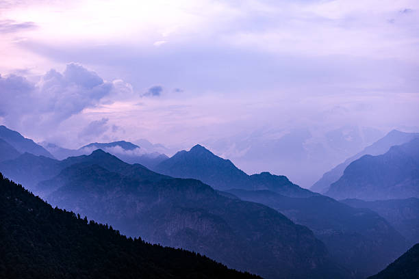 Italian Alps mountains misty landscape stock photo