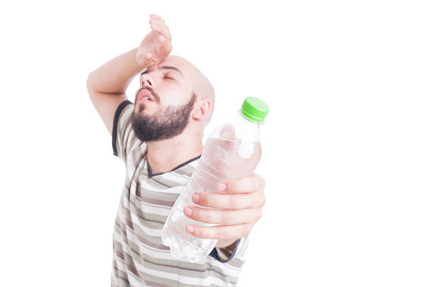 istock Sweaty man holding a bottle of cold water 483863156