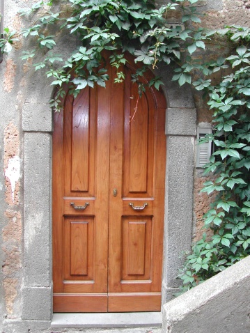 Wooden door entry in Italy.