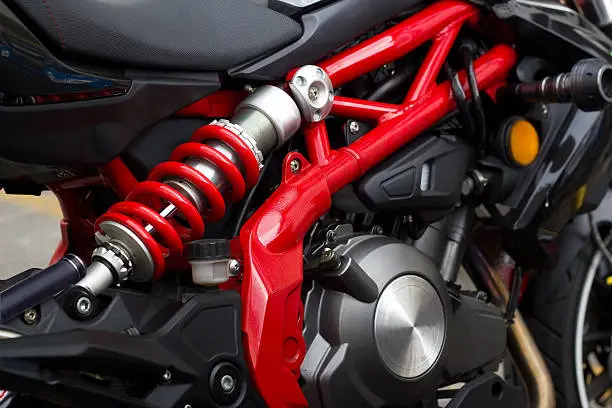 Red Shock Absorber's and frame motorcycle, soft focus