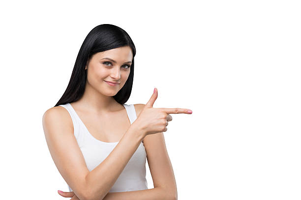 istock woman is in a white tank top and blue denims 483865382