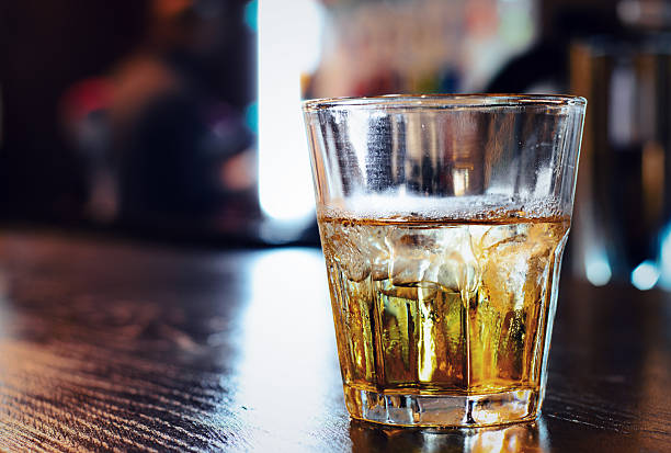 istock Glass of whiskey on a bar counter 483869114