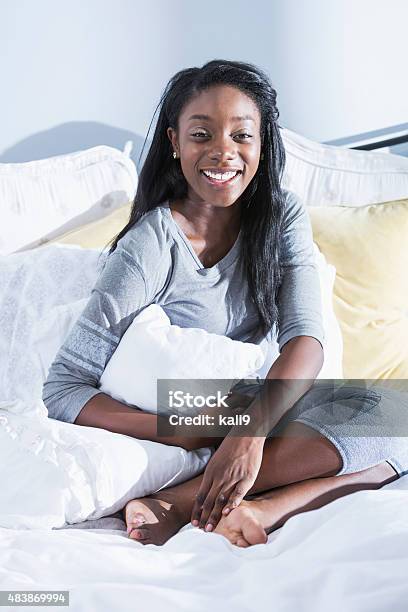 Young African American Woman Sitting Up In Bed Stock Photo - Download Image Now - 20-29 Years, 2015, Adult