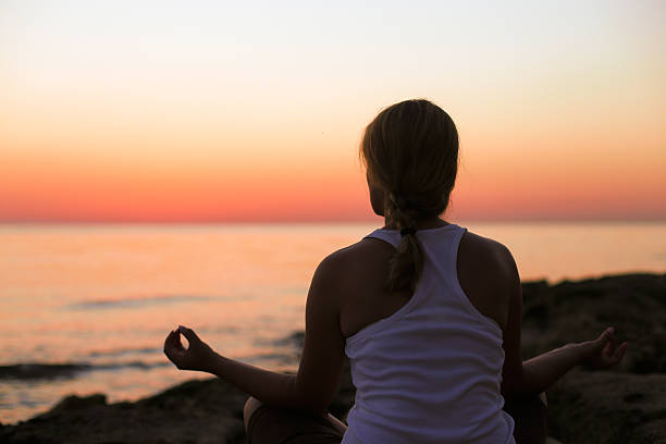 istock Yoga woman over sunset 483870026
