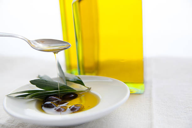 olive oil and olives olive oil and olives on wood 1 Tbsp of Olive Oil stock pictures, royalty-free photos & images