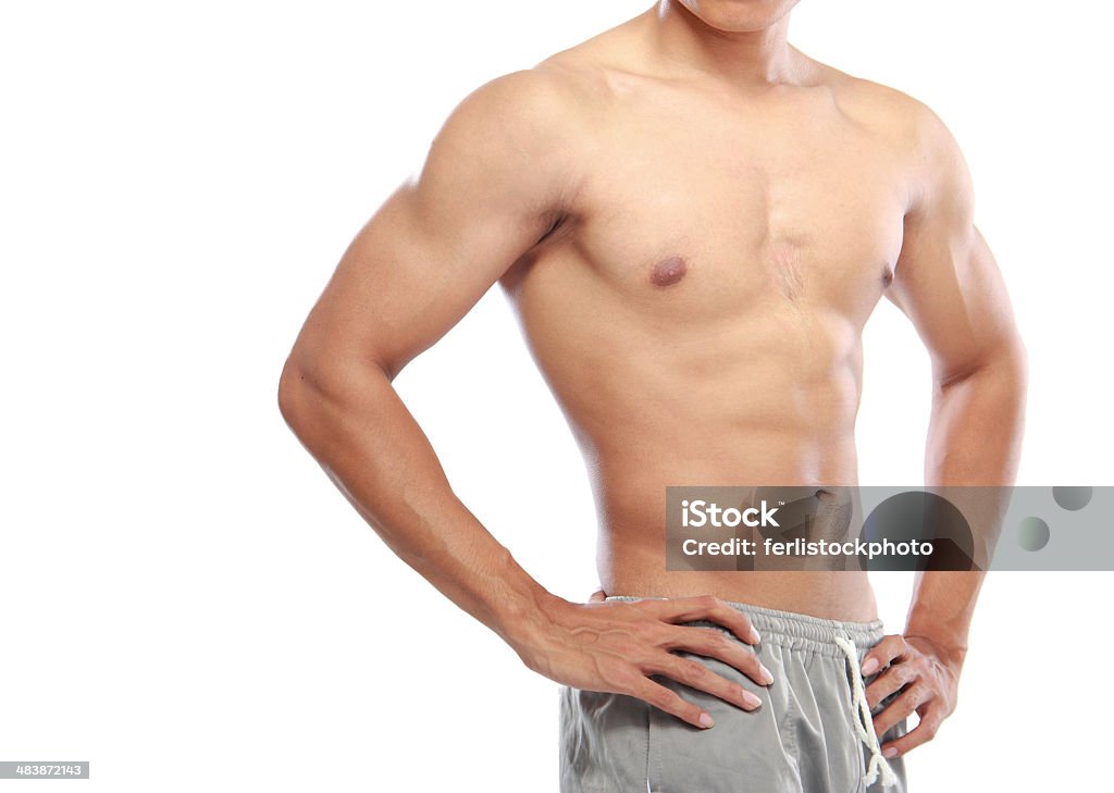 asian bodybuilders a very fit young male flexing his muscles Men Stock Photo
