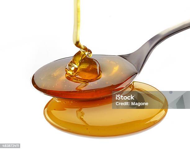 Honey Pouring Into Spoon Stock Photo - Download Image Now - Cooking, Honey, Pouring