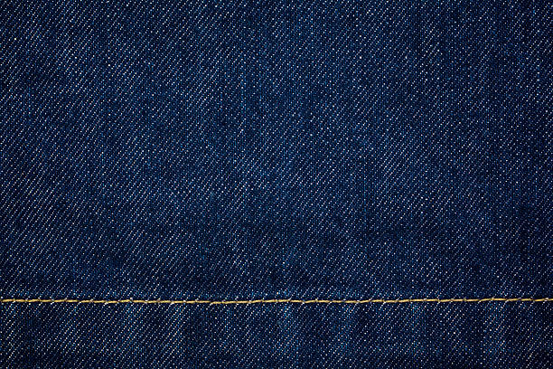 istock raw denim dark wash indigo blue jeans texture background 483872558