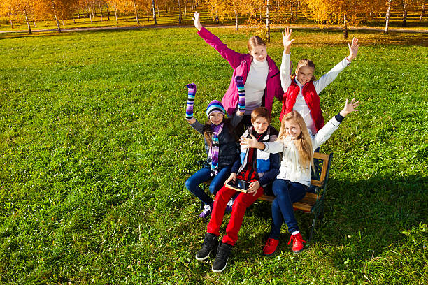 istock Happy teens in autumn park 483873077