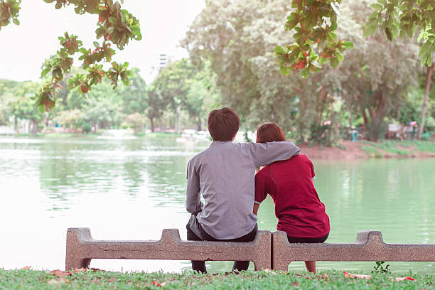 istock asia young couple in love park 483873794