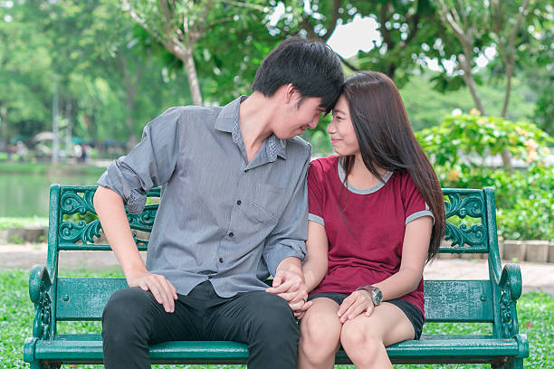istock asia young couple in love park 483873844
