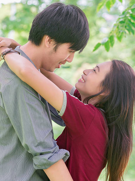 istock asia young couple in love park 483873942